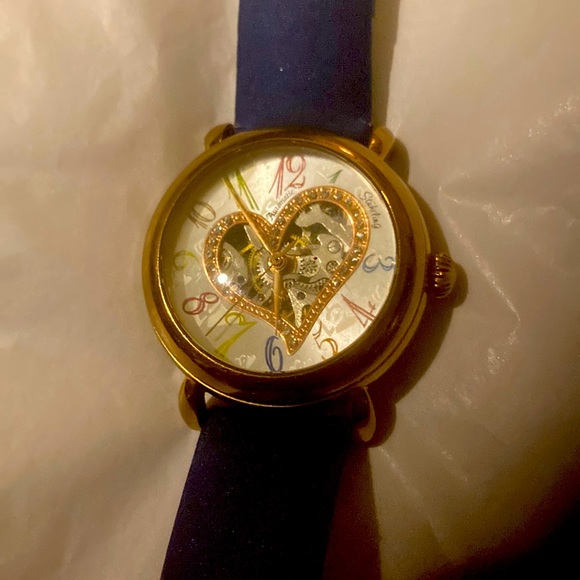Gorgeous Stuhrling woman’s skeleton watch with several colored bands. - Picture 1 of 9
